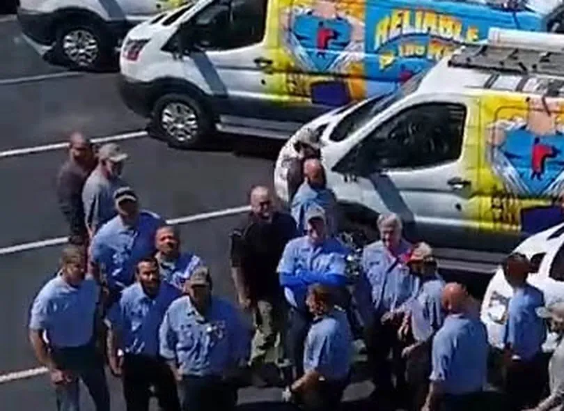 The Reliable Heating & Air technician crew in front of their service vans